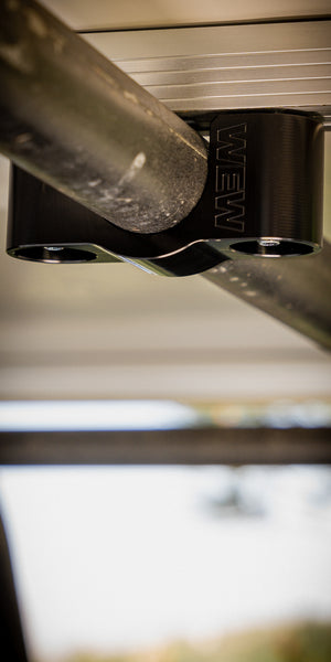 Replace the flimsy stock rooftop tent mounts with our safer, more secure mounts. Our patented design wraps completely around your crossbar and protects the bolt and security nut. We include proprietary nuts and socket keyed only to our company.